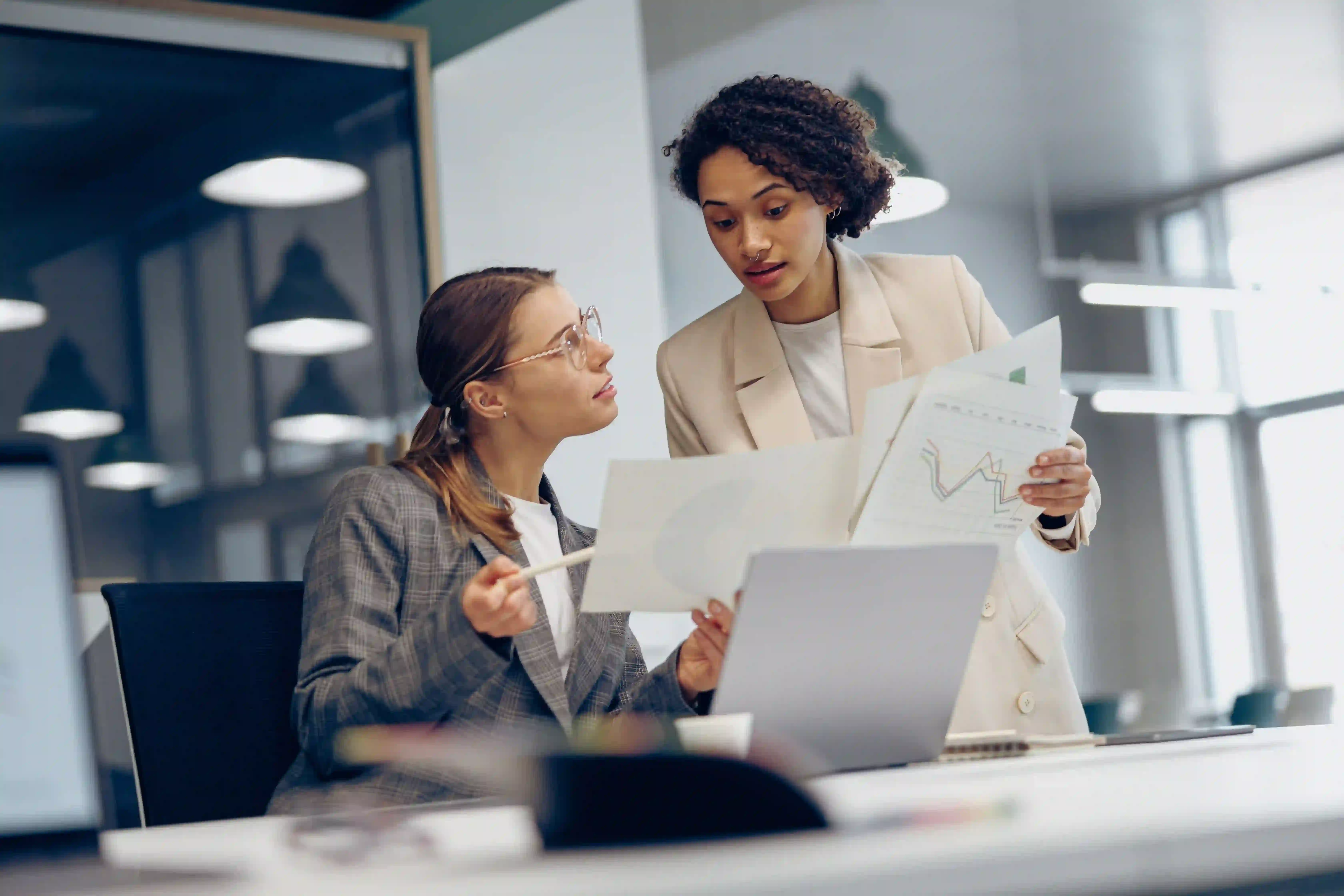 collaborative-women-analyze-charts-in-bright-workp-2026-09-22-01-15-26-utc (1)